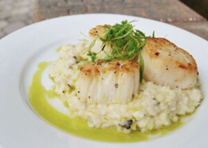 Vessel NOLA Pan Seared Diver Scallops with Tart & Creamy Lemon Truffle Risotto with Chive Oil